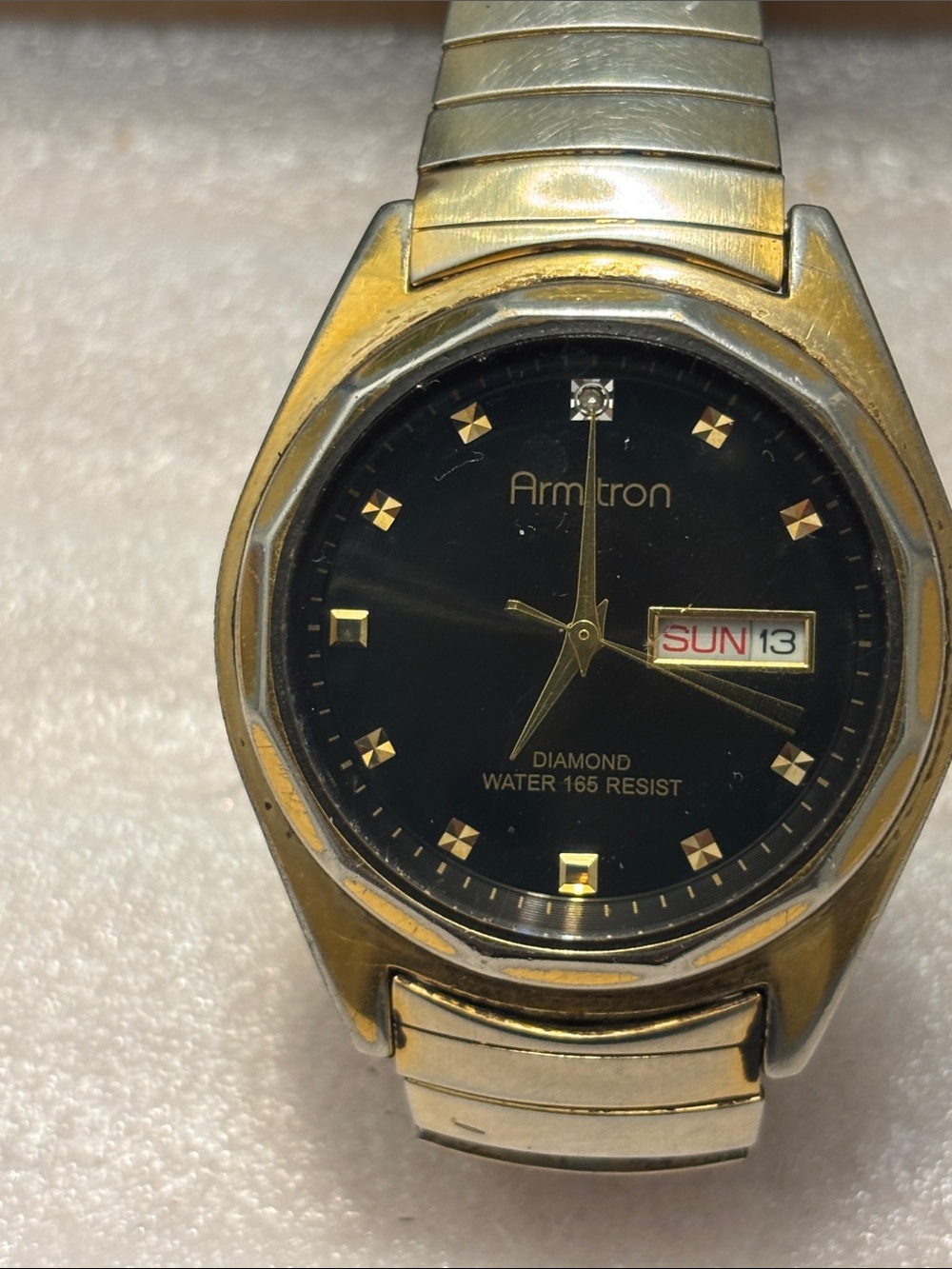 Armitron Gold-Tone Watch with Black Dial and Day-Date